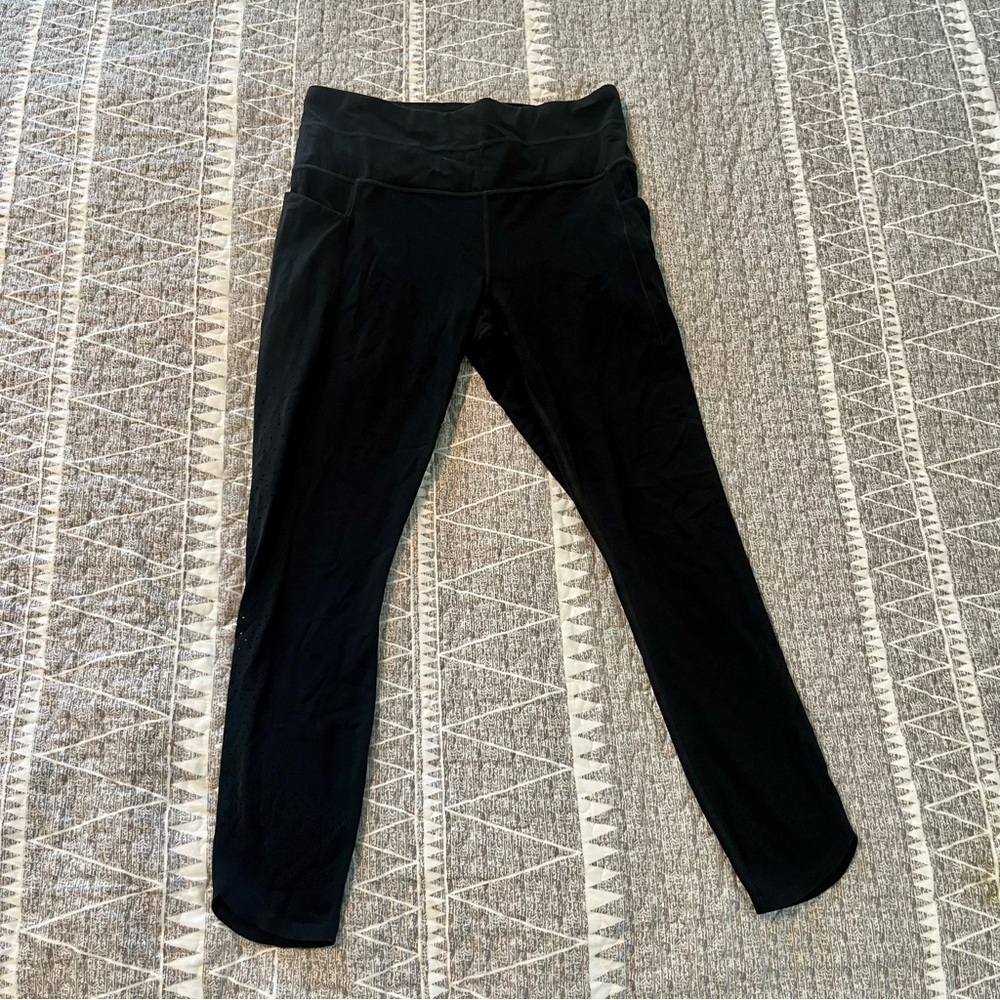 Athleta Salutation Stash Pocket Black Leggings Size M Perforated Calf Detail